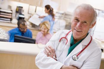 Royalty Free Photo of a Doctor in Front of a Reception Area