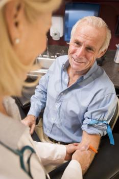 Royalty Free Photo of a Man Having a Blood Test Done