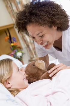 Royalty Free Photo of a Nurse With a Little Girl