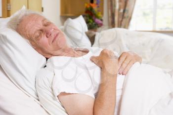 Royalty Free Photo of a Man Sleeping in the Hospital