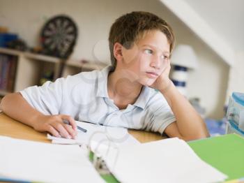 Royalty Free Photo of a Boy Doing His Homework