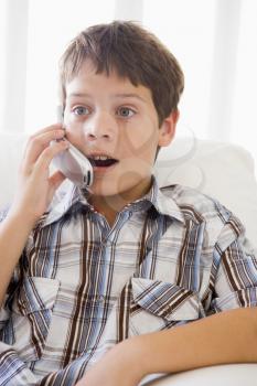 Royalty Free Photo of a Boy Talking on a Mobile Phone