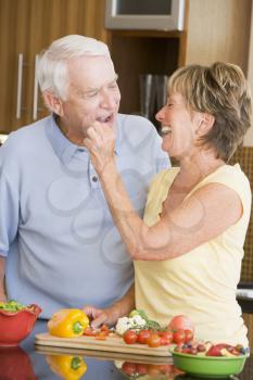 Royalty Free Photo of a Couple With Vegetables