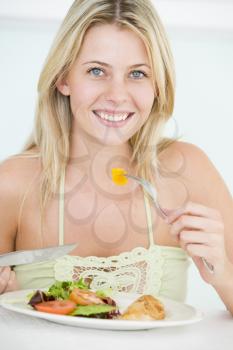 Royalty Free Photo of a Girl Having a Healthy Dinner