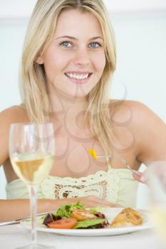 Royalty Free Photo of a Woman Having Wine With Dinner