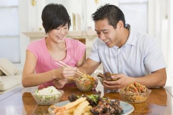 Royalty Free Photo of a Couple Eating Chinese Food