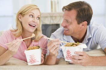 Royalty Free Photo of a Couple Eating Chinese Takeout