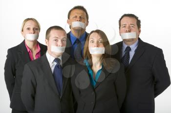 Royalty Free Photo of a Business Team With Taped Mouths