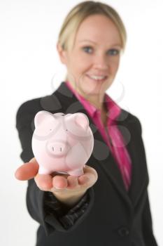 Royalty Free Photo of a Woman Holding a Piggy Bank