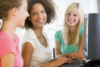 Royalty Free Photo of Girls Using a Computer