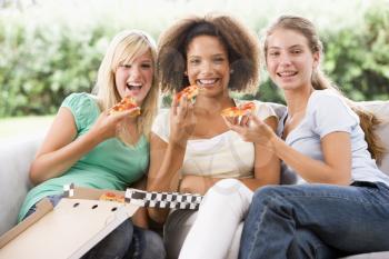 Royalty Free Photo of Girls Eating Pizza