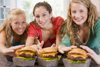 Royalty Free Photo of Girls Having Burgers