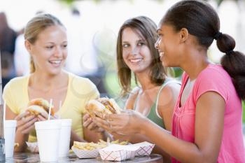 Royalty Free Photo of Girls Eating Fast Food