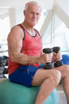 Royalty Free Photo of a Man Using Weights