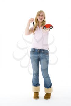 Royalty Free Photo of a Teenage Girl With a Red Toy Car
