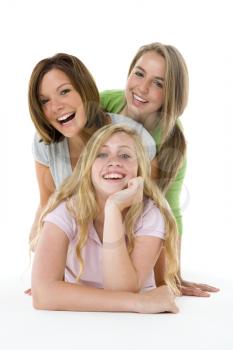 Royalty Free Photo of Three Teenage Girls on the Floor