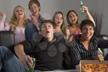 Royalty Free Photo of Teens Having Fun and Eating Pizza