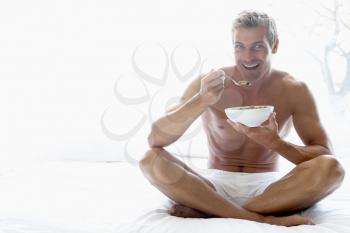 Royalty Free Photo of a Man Eating Cereal