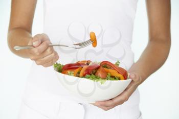 Royalty Free Photo of a Woman Holding Salad
