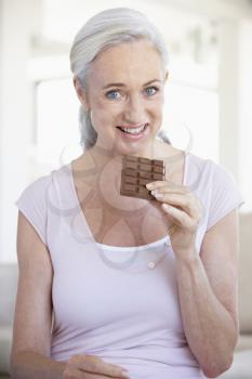 Royalty Free Photo of a Woman Eating Chocolate