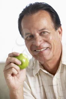 Royalty Free Photo of a Man With an Apple