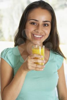 Royalty Free Photo of a Teen With Orange Juice