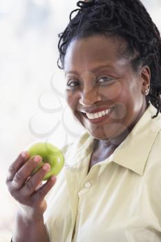 Royalty Free Photo of a Woman With an Apple