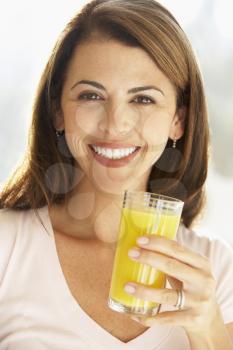 Royalty Free Photo of a Woman With Orange Juice