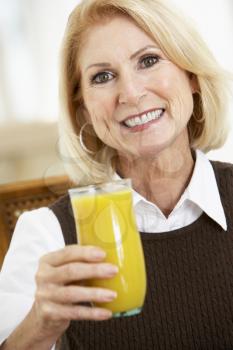 Royalty Free Photo of a Woman With Orange Juice