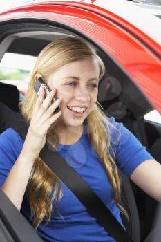 Royalty Free Photo of a Girl in a Car Talking on a Cellphone