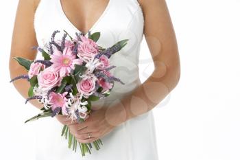 Royalty Free Photo of a Bride Holding Her Flowers
