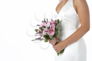 Royalty Free Photo of a Bride Holding Her Flowers