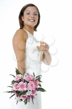 Royalty Free Photo of a Bride With Her Flowers and Champagne