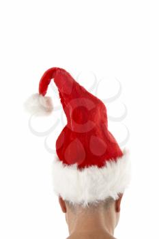 Royalty Free Photo of a Man Wearing a Santa Hat From the Back