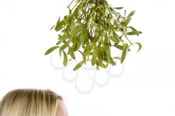 Royalty Free Photo of a Woman Waiting Under the Mistletoe