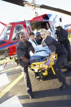 Royalty Free Photo of Paramedics Unloading a Patient From an Air Ambulance