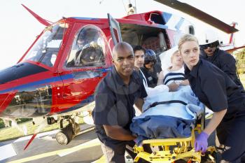 Royalty Free Photo of Paramedics Unloading a Patient From an Air Ambulance
