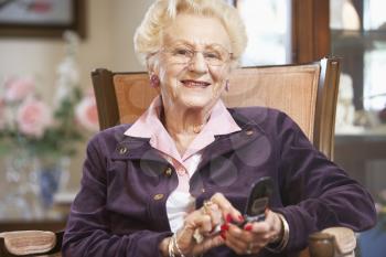 Royalty Free Photo of a Woman Sending a Text Message