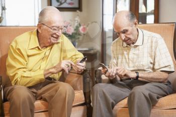 Royalty Free Photo of Two Men Texting