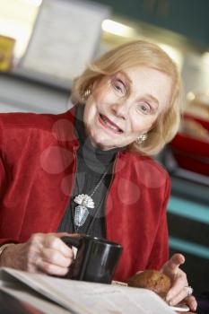 Royalty Free Photo of a Woman Having Coffee