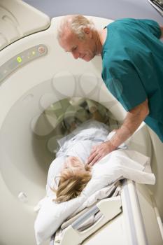 Royalty Free Photo of a Woman Having a CAT Scan