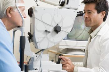 Royalty Free Photo of a Doctor Giving an Eye Exam