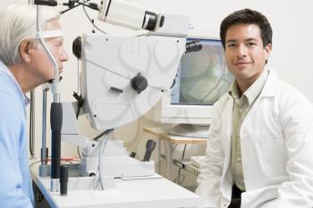Royalty Free Photo of an Eye Doctor and Patient