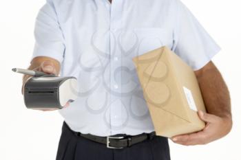Royalty Free Photo of a Courier With a Parcel and Electronic Machine For Signing