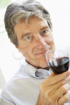 Royalty Free Photo of a Man Drinking Wine