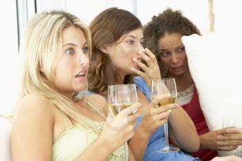 Royalty Free Photo of Girls Watching a Scary Movie