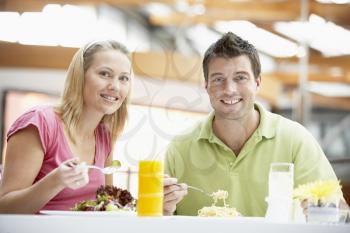 Royalty Free Photo of a Couple Having Lunch at a Mall