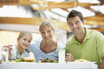 Royalty Free Photo of a Family Having Lunch at a Mall
