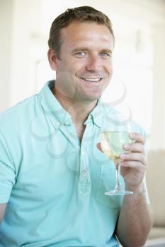 Royalty Free Photo of a Man Enjoying a Glass of Wine