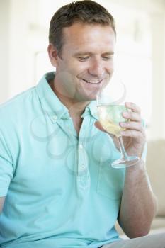 Royalty Free Photo of a Man Enjoying a Glass of Wine